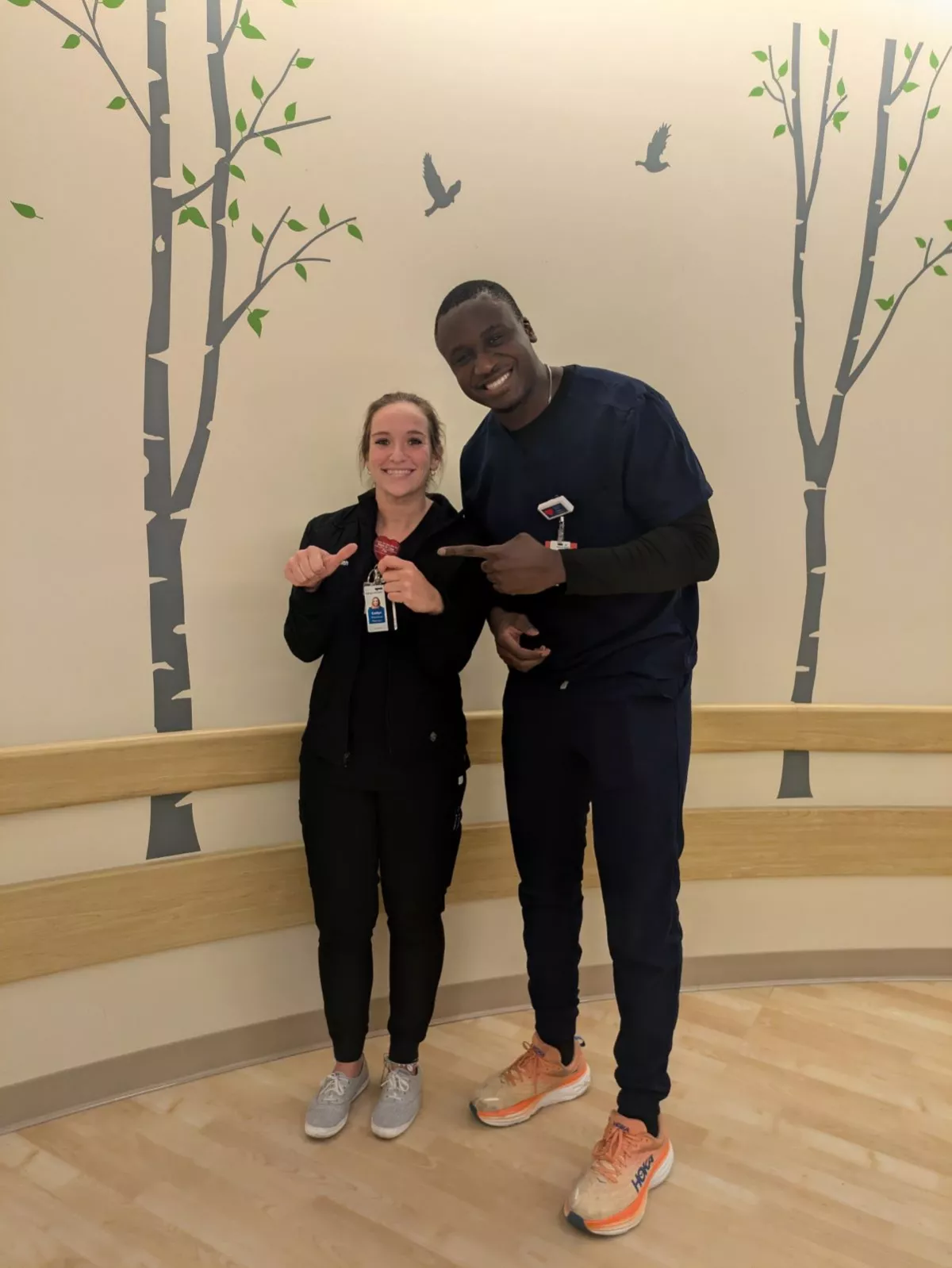 Eseman with Steven Atipo Kom, the nurse who helped care for her mother-in-law.